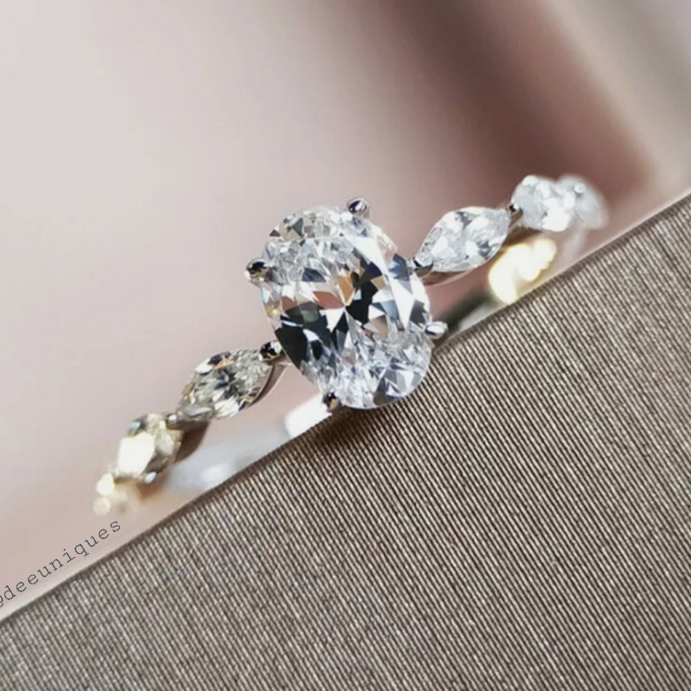 Dainty Oval cubic zirconia with marquise side ring